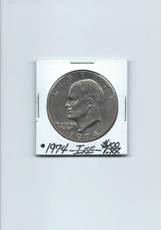 Ike - - 1974 - Philladelphia - - $1.  Oo Coin - - A U (eagle On Reverse Side) photo