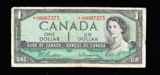 1954 Bank Of Canada $1 Replacement I/o 0667375 Prefix Beattie Rasminsky photo