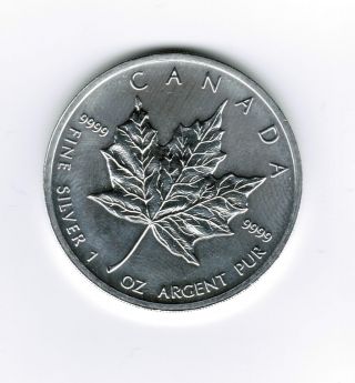2012 - 1 Oz Canadian Silver.  9999 Maple Leaf Coin - - One Troy Oz photo