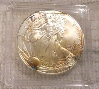 1999 Silver American Eagle Coin - Rainbow Toned - Brilliant Uncirculated photo