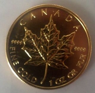 2012 1 Oz Gold Canadian Maple Leaf -.  9999 Fine photo