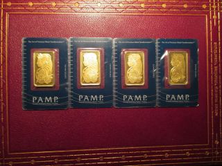 Four One Ounce Gold Ingots. . . .  All In Packing. photo