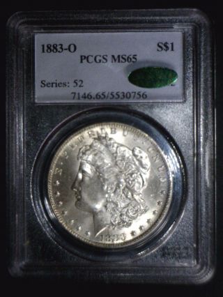 1883 O Morgan Silver Dollar Graded By Pcgs As Ms65 With A Green Cac Sticker photo