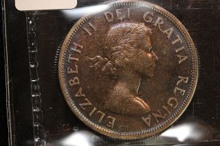 1957 Canada.  1$ Dollar.  Voyageur.  Dark Toned.  Iccs Graded Pl - 65.  (xrp155) photo