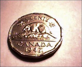 1947 Canadian Nickel With Mark Next To Date photo