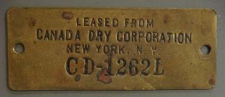 Brass Tag - Leased From Canada Dry Corporation,  York,  N.  Y.  Cd - 1262 L photo