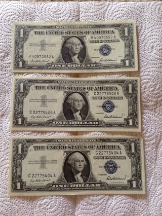 Three One Dollar Silver Certificates.  1957 photo