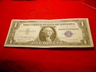 1957 - - A $1 Silver Certificate Great Star Note 8 photo