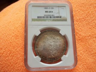 .  Bre. . . .  1885 - O Morgan Silver Dollar. .  Graded Ms - 64 By Ngc photo