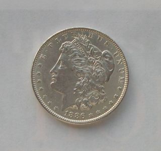 1886 Morgan Silver Dollar Brilliant White Coin Unc.  Details photo