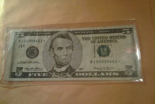 1 - 1999 - 5 Doller Star Note Low Serial Number Rare Fed.  Res.  Off Center Cut photo