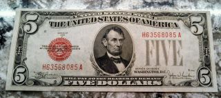 1928 E $5 Dollar Bill,  Crisp Bright Red Seal Rare In This photo