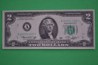 One 1976 Uncirculated Low Serial Number $2.  00 Star Note photo