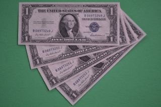 Four 1935 F Consecutive & Uncirculated $1.  00 Silver Certificates photo