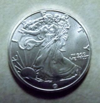Silver American Eagle Design,  Walking Liberty 3.  11 Gram 1/10 Ounce.  999 Fine photo