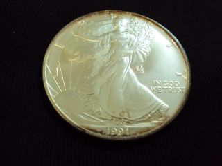Coinhunters - 1991 American Silver Eagle - State - Toned photo