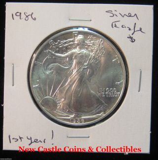 1986 $1 Silver Eagle.  1oz. .  999 Silver.  1st Year.  Spec - photo