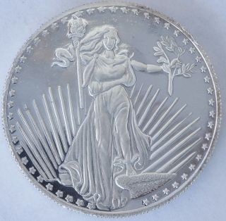 1 Oz Silver Round Lady Liberty Eagle Reverse.  999 Silver Older Round photo
