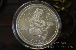 1 Oz Silver Round 2012 Year Of The Dragon.  999 Fine Silver Proof Like Coin photo