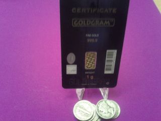 1 Gram Of Pure.  9999 Igr Gold (in Assay Card) And 10 Junk Silver Dimes. photo