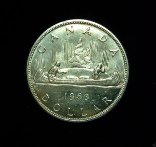Canada 1963 Dollar Coin.  800 Silver Bu Voyageur photo