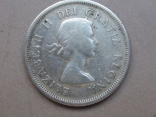 1958 Circulated Canadian Quarter (25c Silver Coin).  1201 photo