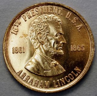 Abraham Lincoln 16th President Of The U.  S.  A.  Brass Collector Token. . .  10594 photo