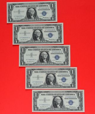 Five 1957 Consecutive & Uncirculated $1.  00 Silver Certificates photo