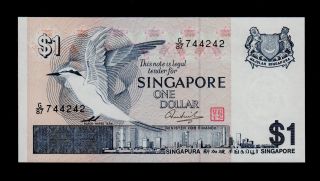 Singapore 1 Dollar (1976) G/87 Pick 9 Unc. photo