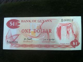 Guyana $1 Uncirculated Banknote - Edges Intact - Rice/ Kaietur Falls photo