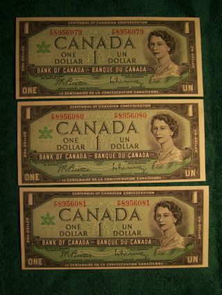3 1967 Canadian Uncirculated One Dollar Bills - Sequential Serial Numbers photo