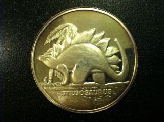 Stegosaurus 1 Troy Oz.  999 Silver Round - Lightly Circulated Dinosaur photo
