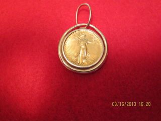 1986 $10.  00 1/4oz American Eagle Gold Coin With Bezel. photo