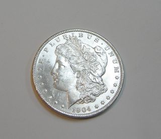 1904 - O U.  S.  Morgan Silver Dollar Bu 162 - F photo