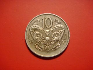 Zealand 10 Cents,  1975 Coin.  Maori Mask.  Koruru photo