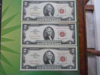 Trio (3) Series 1963 $2 Bills,  Au++/uncirculated photo