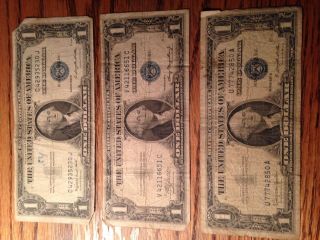 Three Poor Silver Certificate $1 (1935 G,  1935 A,  1957 B) photo