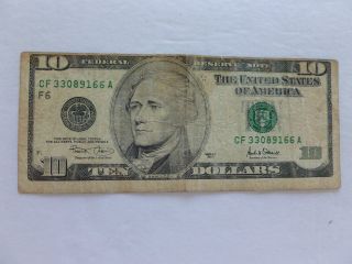 $10.  00 Miscut Federal Reserve Note 2001 - Circulated With Vertical Fold photo
