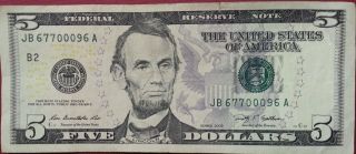 2009 $5 Five Dollar Bill.  Fancy Repeating Serial Number 67700096.  Triple Zero ' S photo
