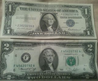 1957 Series 1$ Silver Certificate And A 1976 Series 2$ Bill photo