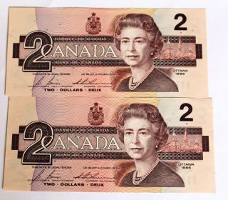 Canadian $2 Dollar Dollar Bills X 2: Consecutive Serial Numbers; Final Year 1986 photo