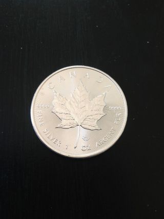 2014 Canadian Maple Leaf 1 Oz. .  999 Pure Silver Coin photo