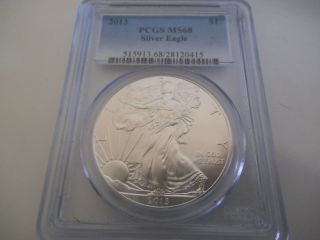 Uncirculated Pcgs Graded And Ms68 2013 American Eagle Silver Dollar photo