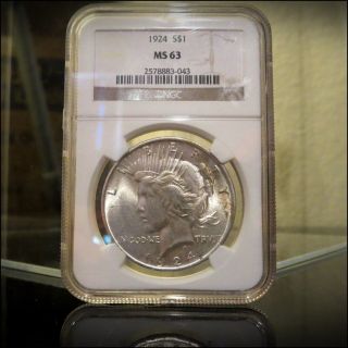 1924 U.  S.  Silver Peace Dollar - Cased And Graded Ms63 By Ngc - photo