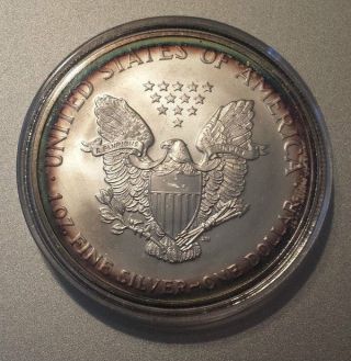 2004 American Silver Eagle - Rainbow Toned Rim - Bright Capsulated Coin photo
