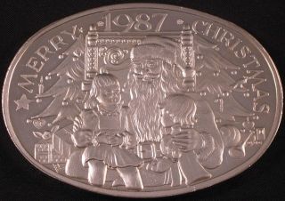3 Ounce 1987 Merry Christmas Trees Santa Chair Children & Gifts Silver Round Bar photo