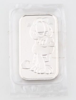 . 999 Silver 1 Troy Oz.  Bar Featuring Garfield The Cat By Paws photo