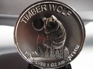 Timberwolf/maple Leaf 1oz. .  999 Fine Silver Round photo