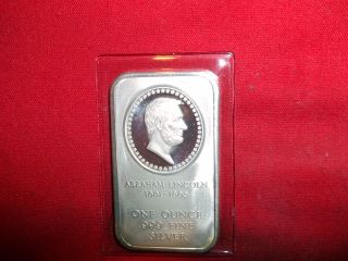 One Troy Ounce.  999 Fine Silver Bar,  Abrham Lincoln Design,  Uncirculated photo