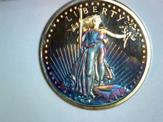 1 Oz Silver Round - Rainbow Toned Saint Gaudens Design 0.  999 Fine photo